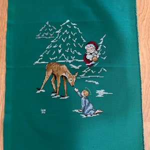 Christmas deer and Santa cross stitched picture. Unframed