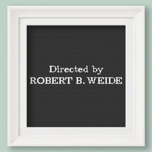 May include: A black and white framed print with the text "Directed by ROBERT B. WEIDE" in a white font.