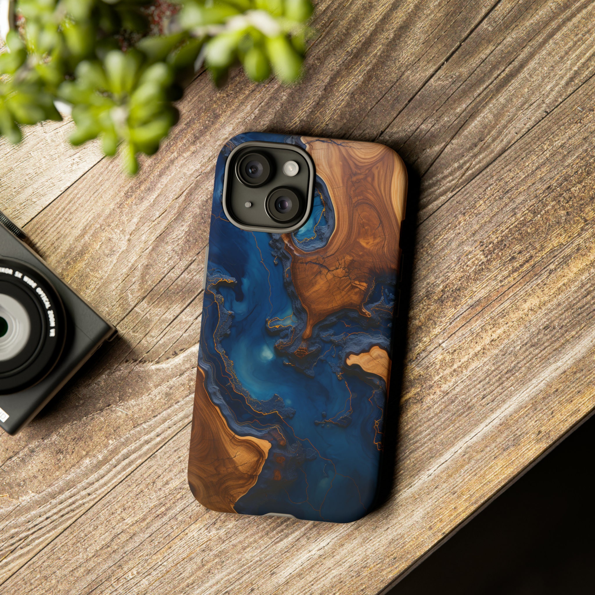 iPhone 13 case with wood finishing and Behemoth 'CONTRA' logo