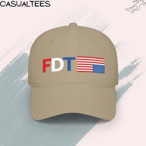 Low-profile baseball cap displaying an FDT graphic with an inverted U.S. flag, representing political dissent and resistance to Trump-era leadership.