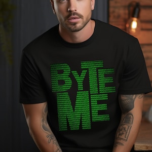 May include: A black t-shirt with a green graphic that says "BYE ME" in a binary code font.
