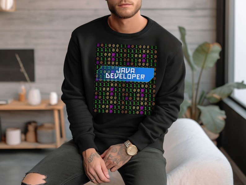 May include: Black sweatshirt with a pattern of binary code and the text "JAVA DEVELOPER" in a blue box.