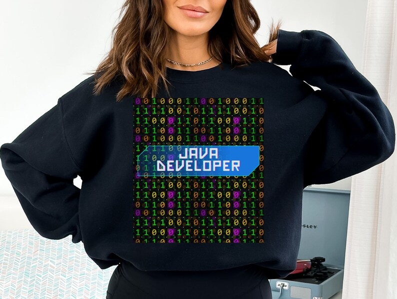 May include: Black sweatshirt with a graphic of binary code and the text "JAVA DEVELOPER" in a blue box.