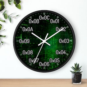 May include: A black and green clock with white hands and a digital pattern. The clock face has numbers 0x01 through 0x0C.