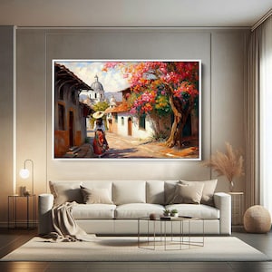 May include: A painting of a woman in a colorful dress walking down a street in a small town. The street is lined with white buildings and there is a large tree with pink flowers in the background.