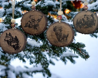 Personalized woodland Christmas Ornaments featuring bear, bison, deer, and wolves. Customized engraved rustic ornaments for the holidays.