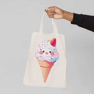 May include: A white tote bag with a cartoon ice cream cone with a strawberry on top. The ice cream cone has a smiling face and is decorated with sprinkles.