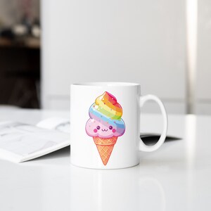 May include: White ceramic mug with a colorful rainbow ice cream cone design. The ice cream cone has a happy face and is decorated with sprinkles.