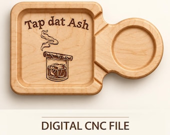 May include: A light-colored wooden tray featuring a square section with a circular cutout on the right side. The tray is engraved with the text Tap dat Ash above an illustration of a glass with a cigar resting on top and rising smoke.