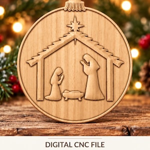 May include: A round wooden ornament featuring a laser-engraved nativity scene with a stable, a star, and three figures. The text below reads DIGITAL CNC FILE NO PHYSICAL PRODUCT. The ornament has a small hole at the top for hanging.