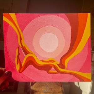 May include: Acrylic painting on canvas featuring a figure in shades of yellow, orange, and red against a pink and peach background. The artwork has a circular design with a sun-like element.