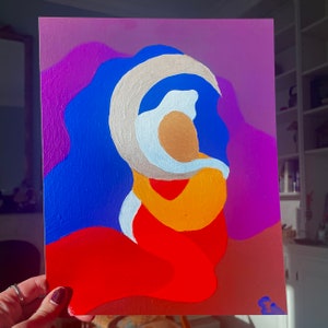 May include: Abstract acrylic painting featuring a figure in warm tones of orange and red, embraced by a white and gold crescent shape against a blue background. The background transitions from purple to red.