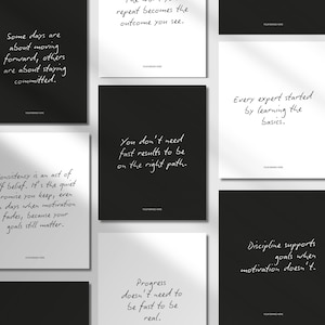 May include: A selection of black and white prints featuring motivational quotes in a handwritten style. Quotes include "You don't need fast results" and "Discipline supports goals." The prints are displayed on a white surface.