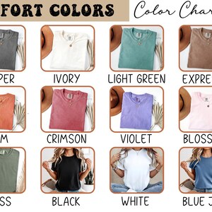 May include: Color chart showcasing Comfort Colors t-shirts in various hues. The image displays shirts in colors like Pepper, Ivory, Light Green, Expresso, Yam, Crimson, Violet, Blossom, Moss, Black, White, and Blue Jean. Each shirt is displayed with a hat.