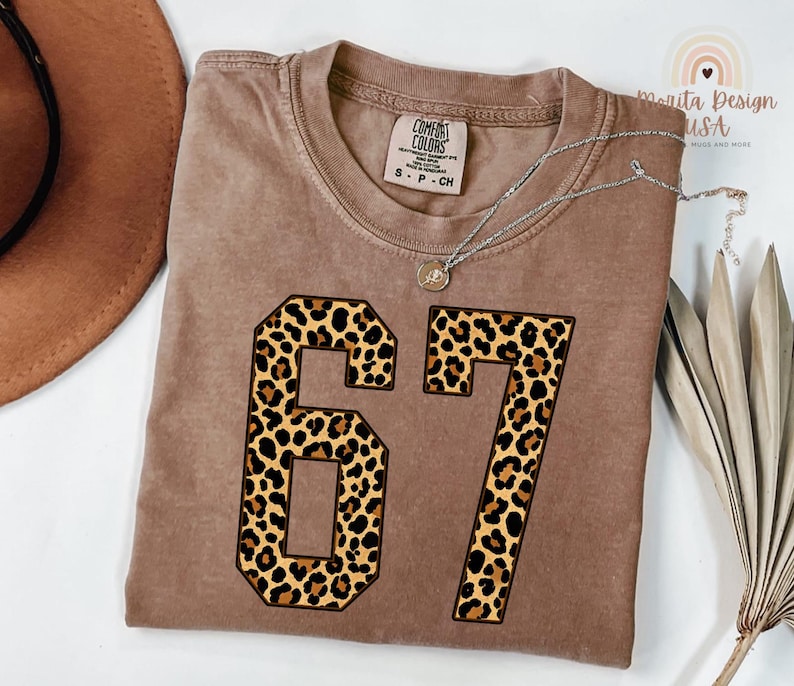 comfort colors expresso t-shirt with large leopard print 67 number design, folded viral meme top with animal print aesthetic