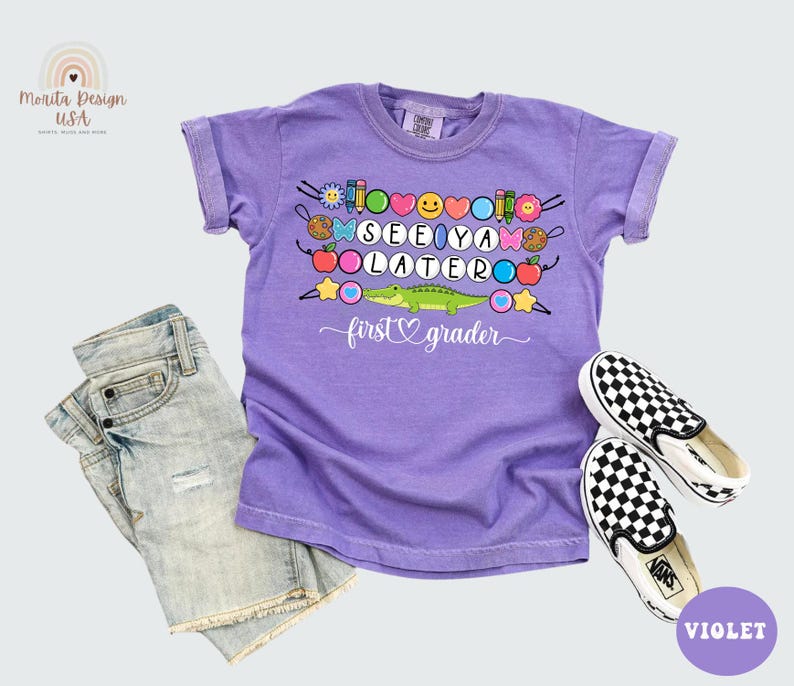 May include: A violet short-sleeved t-shirt with the words "SEE YA LATER first grader" and a cartoon alligator design. The shirt is paired with denim shorts and black and white checkered slip-on shoes.