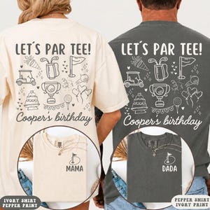 May include: Two t-shirts, one cream and one charcoal gray, featuring a back graphic with golf icons, a party banner, and the text "LET'S PAR TEE! Cooper's birthday". The front chest area displays a small golf flag icon with "MAMA" or "DADA" text.