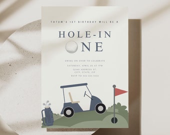May include: A golf-themed birthday invitation with a blue golf cart, a golf bag, and a golf ball. The invitation reads "Tatum's 1st Birthday Will Be A Hole-In-One" and includes details for the party.