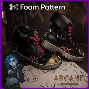 May include: Black boots with pink laces, a gold toe cap, and metallic hardware. The boots are displayed on a paper template labeled Foam Pattern and Arcane League of Legends, featuring an illustration of a blue-haired character in the corner.