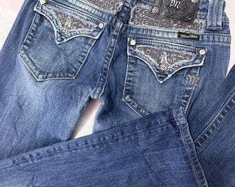 miss me? medium-wash low-rise leopard print embellished bootcut jeans. gyaru ~ grunge mcbling piece (missing a stud on the back logo)