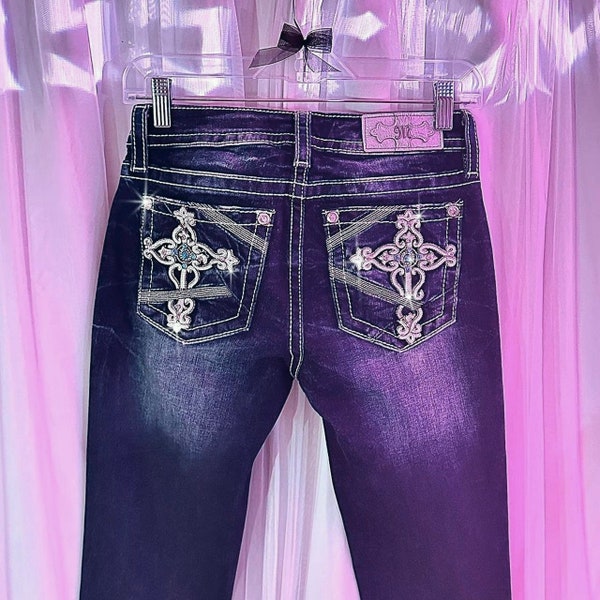 miss me? medium wash 2000’s cross embellished slim-bootcut jeans. flawless vintage grunge styled piece, with turquoise gems