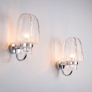 Pair of Glashutte Limburg wall lamps with chromed frame and bubble glass shades