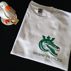 Swamp Princess Minimalist Logo Graphic Tee! 100% Cotton Swamp Princess t-shirt. University Florida Go Gators! Florida girls come here!