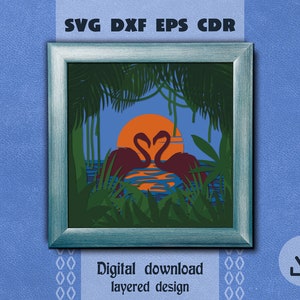 May include: A framed digital art print featuring a layered design of two flamingos with heart-shaped necks, set against a sunset over water. The artwork includes tropical foliage and the text "SVG DXF EPS CDR" and "Digital download layered design".