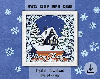 May include: A white frame containing a blue and white layered paper cut design of a snow globe with a house and trees inside. The snow globe is surrounded by snowflakes. The text "Merry Christmas" is written in a decorative font below the snow globe.