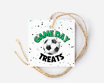 May include: White gift tag with black and green polka dots. The tag has a green and black graphic that says "Game Day Treats" with a black and white soccer ball in the center.