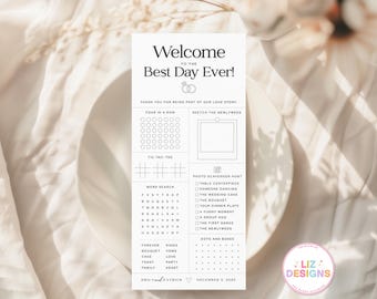 May include: A vertical wedding sign with the text "Welcome to the Best Day Ever!" and various games and activities. The sign includes a word search, tic-tac-toe, and a photo scavenger hunt. The sign is white with black text and is on a white background.
