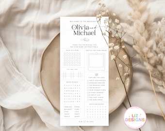 May include: A wedding activity card with the names "Olivia and Michael" at the top. The card includes games like Four in a Row, Tic-Tac-Toe, and a word search. The card is on a beige plate with floral accents.