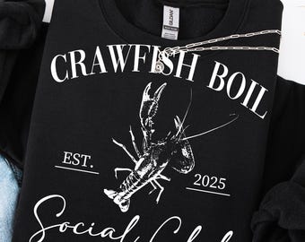 May include: Black sweatshirt with white text that reads "Crawfish Boil Social Club Est. 2025" and a white illustration of a crawfish.