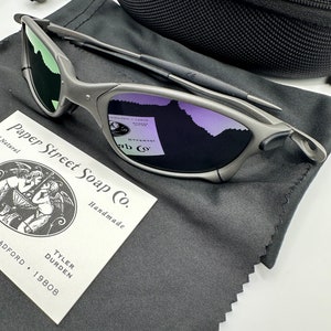 May include: A pair of silver-colored sunglasses with a black microfiber cleaning cloth and a small business card that reads "Paper Street Soap Co. Handmade Tyler Durden Radford 19808".