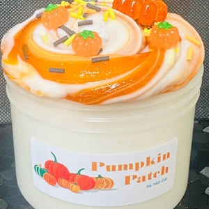 May include: A jar of white slime with orange and white swirls, topped with orange pumpkin decorations and sprinkles. The jar has a label that reads "Pumpkin Patch" with pumpkin illustrations.
