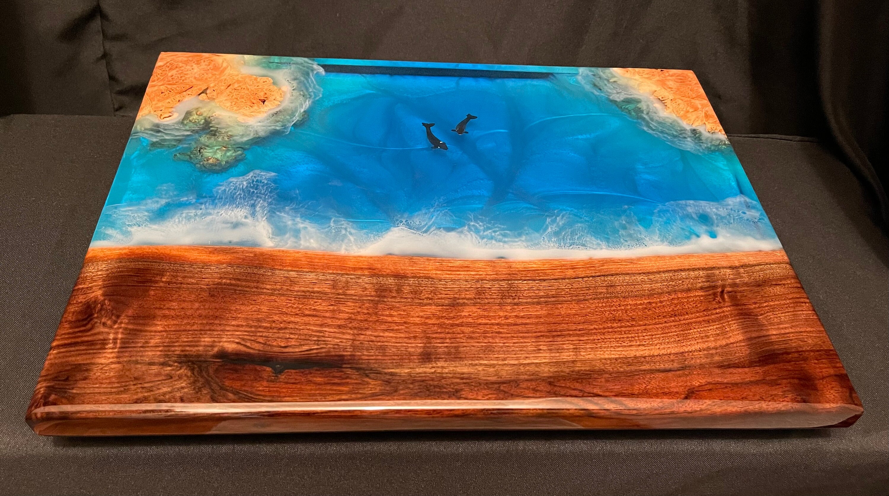 Very solid charcuterie board made from walnut, maple burl and food safe epoxy. 17 1/2” x 13 1/4” x 1 1/4”.