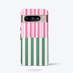 May include: A smartphone case with a vertical striped design. The top half features pink and white stripes, while the bottom half has green and white stripes. The case has a camera cutout and the brand name "CASEBERY" is printed at the bottom.