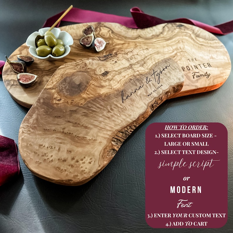 May include: Two wooden serving boards with natural edges. One board is engraved with "hanna & tyson" and the date. The other board is engraved with "THE POINTER Family". A small bowl of olives and figs are on the boards.