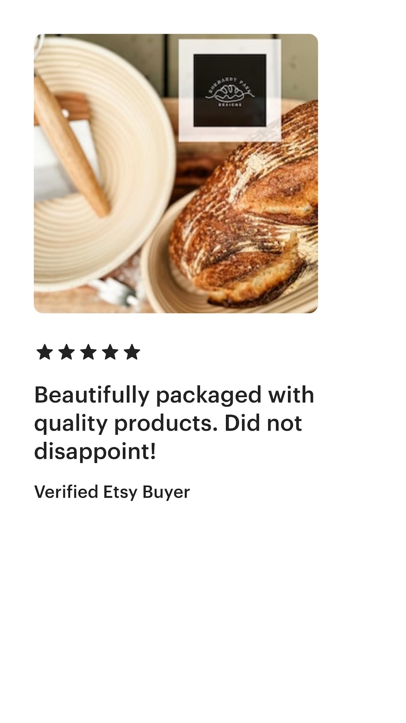 May include: A close-up of a sourdough bread loaf in a round, woven bread basket. The bread has a dark brown crust and a light brown interior. The basket is made of natural, light brown wicker. The image also includes a wooden dough scraper.