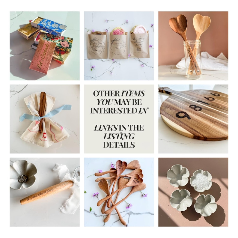 May include: A collection of kitchen and home decor items. Includes wooden heart-shaped spoons, a wooden cutting board with numbers, decorative matchboxes, and small ceramic bowls. Some items have text, including "Let's Celebrate".