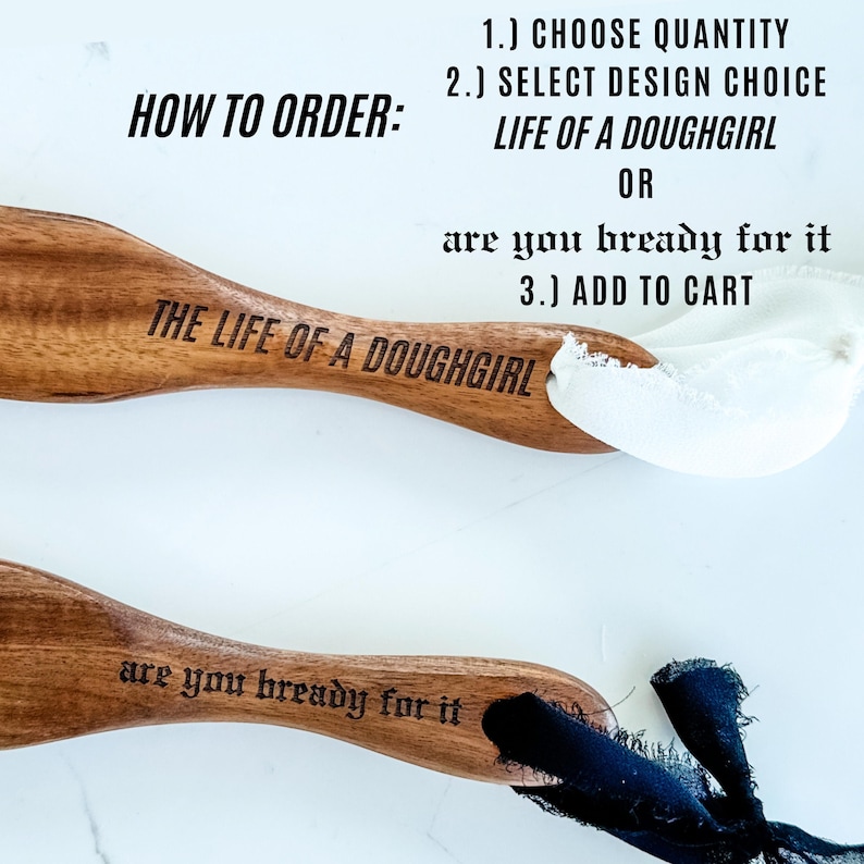 May include: Two wooden spoons with engraved text. One reads "THE LIFE OF A DOUGHGIRL" and the other "are you bready for it". Instructions on how to order are in the background.