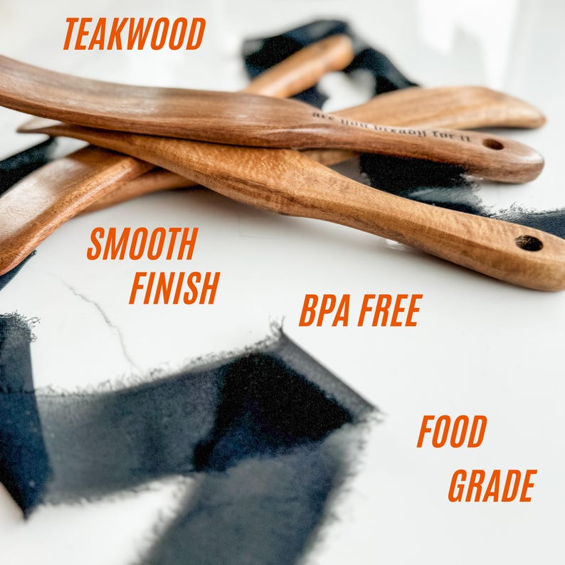 May include: Wooden kitchen utensils made of teakwood with a smooth finish. The image shows several spatulas with the words "Smooth Finish", "BPA Free", and "Food Grade".