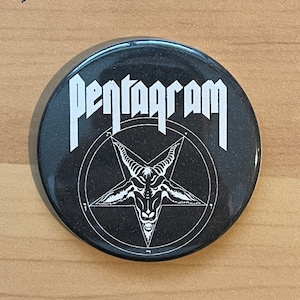 May include: Black and white button featuring the word "Pentagram" in white lettering and a pentagram with a goat's head inside.