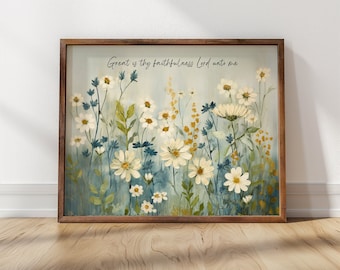 May include: A framed print featuring a watercolour painting of white flowers with yellow centres and green leaves against a blue background. The text "Great is thy faithfulness Lord unto me" is written in black at the top of the print.