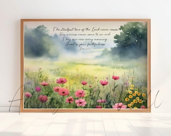 May include: Watercolor print in a wooden frame. The artwork depicts a field of pink and yellow wildflowers under a soft, misty sky. Text reads: "The steadfast love of the Lord never ceases...Great is your faithfulness. Lam 3:22."