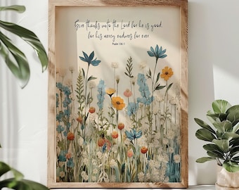 May include: A framed print featuring a floral design and a bible verse: "Give thanks unto the Lord for he is good. For his mercy endures for ever. Psalm 136:1"