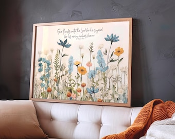 May include: A framed floral print featuring a variety of colorful flowers in shades of blue, yellow, and orange. The artwork includes the text "Give thanks unto the Lord for he is good for his mercy endureth forever" in elegant script. The frame is made of light-colored wood.