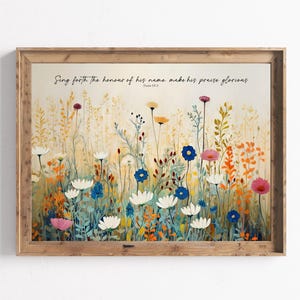 May include: A watercolour painting of a field of wildflowers in shades of blue, white, pink, orange, and yellow. The text "Sing forth the honour of his name, make his praise glorious" is written in black cursive at the top of the painting. The text "Psalm 66:2" is written in smaller black cursive below the main text.