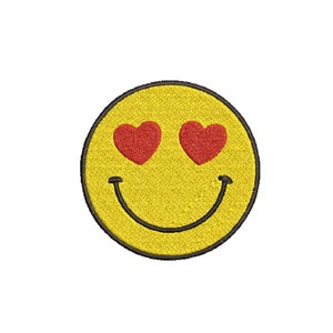 May include: Yellow smiley face with red heart eyes. The smiley face is embroidered and has a black outline.