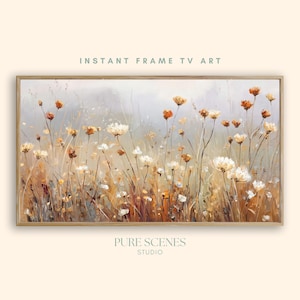 Pode incluir: Uma impressão de arte de parede retangular apresentando um campo de flores silvestres em tons de branco, creme e laranja queimado contra um fundo cinza suave e atenuado. O texto INSTANT FRAME TV ART e PURE SCENES STUDIO é visível.